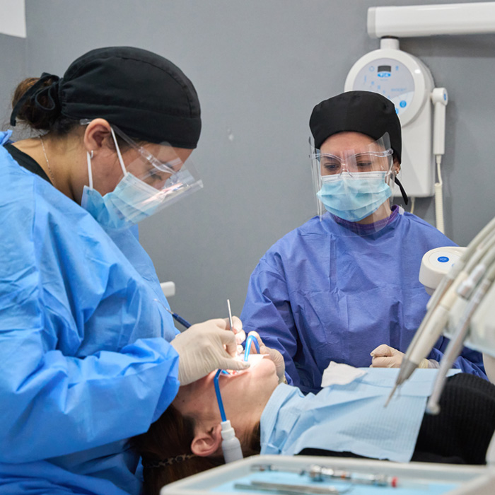dentist-performing-root-canal-treatment-procedure-on-patient-1